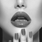 black and white photo of woman with beautiful lips and nails