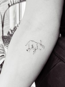 tiny tattoo of an abstract elephant on forearm, permanent makeup in Raleigh